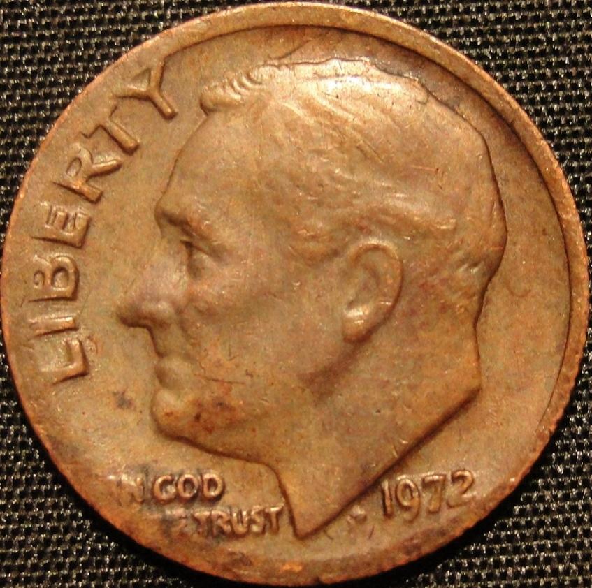 1972 Roosevelt dime missing clad layer error showing exposed copper core on one side